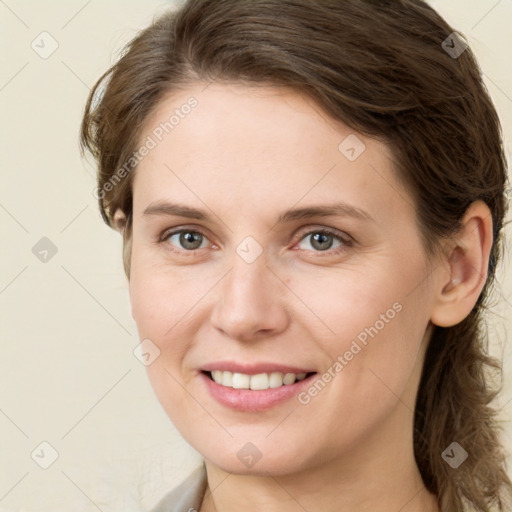 Joyful white young-adult female with medium  brown hair and green eyes