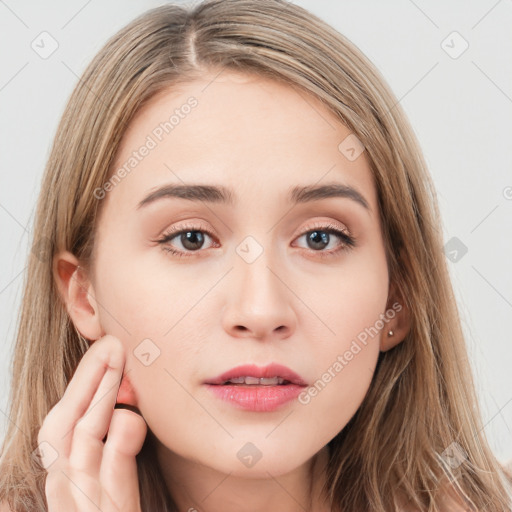 Neutral white young-adult female with long  brown hair and brown eyes