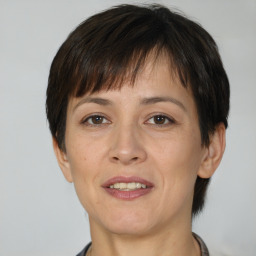 Joyful white adult female with short  brown hair and brown eyes