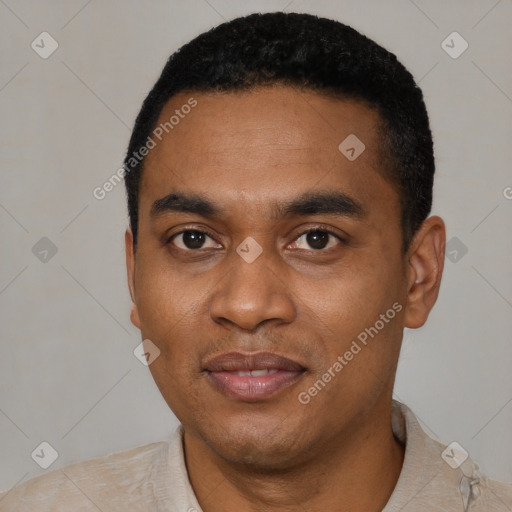 Joyful black young-adult male with short  black hair and brown eyes