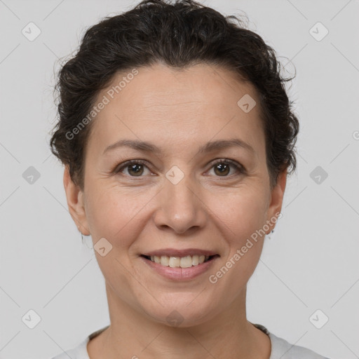 Joyful white adult female with short  brown hair and brown eyes