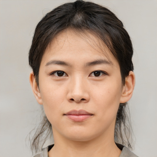 Neutral asian young-adult female with medium  brown hair and brown eyes