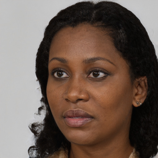 Neutral black young-adult female with long  black hair and brown eyes