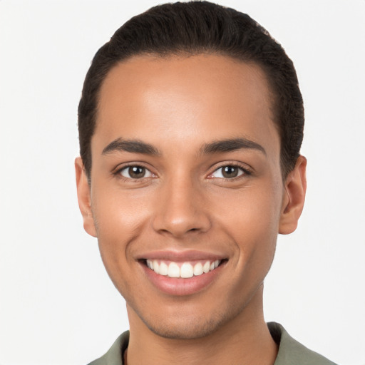 Joyful white young-adult male with short  brown hair and brown eyes