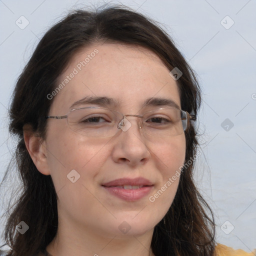 Joyful white adult female with long  brown hair and brown eyes