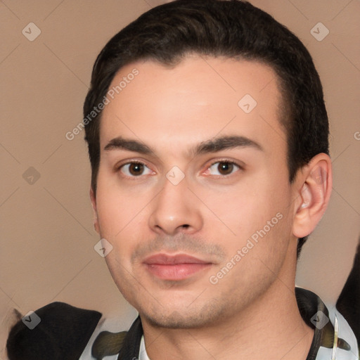 Joyful white young-adult male with short  black hair and brown eyes