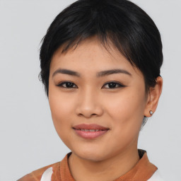 Joyful asian young-adult female with short  black hair and brown eyes