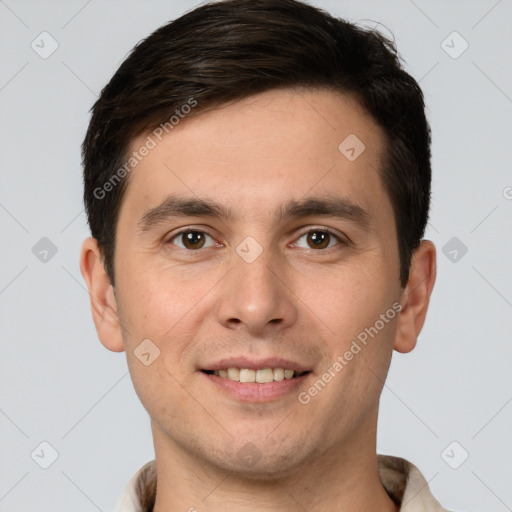 Joyful white young-adult male with short  brown hair and brown eyes