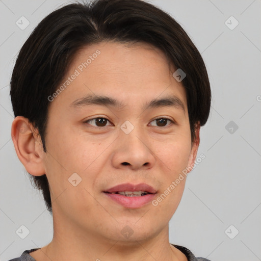 Joyful asian young-adult male with short  brown hair and brown eyes