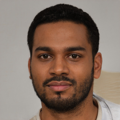 Neutral black young-adult male with short  black hair and brown eyes