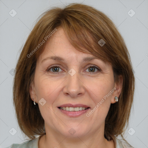 Joyful white adult female with medium  brown hair and grey eyes