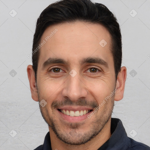 Joyful white adult male with short  brown hair and brown eyes