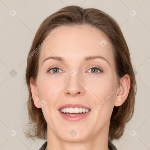 Joyful white young-adult female with medium  brown hair and grey eyes