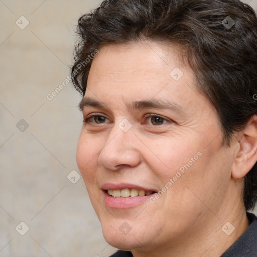 Joyful white adult female with short  brown hair and brown eyes