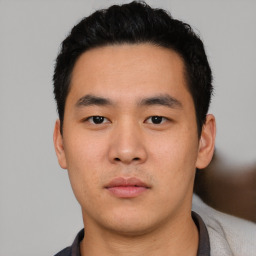 Neutral asian young-adult male with short  black hair and brown eyes