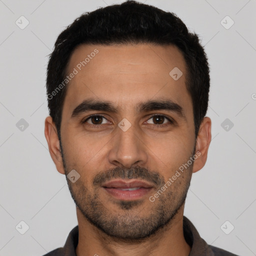 Joyful latino young-adult male with short  black hair and brown eyes