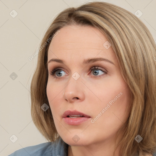 Neutral white young-adult female with long  brown hair and blue eyes