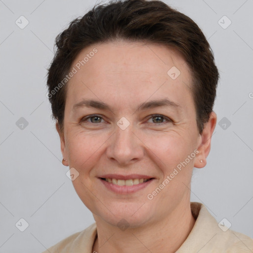 Joyful white adult female with short  brown hair and brown eyes