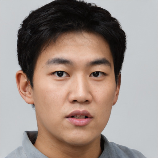 Neutral asian young-adult male with short  black hair and brown eyes