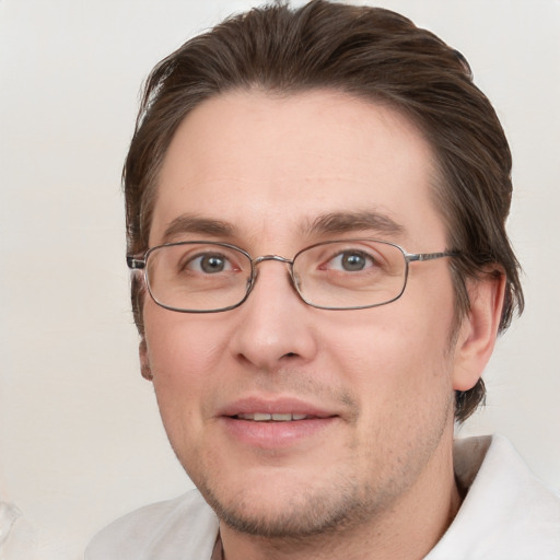 Joyful white adult male with short  brown hair and grey eyes