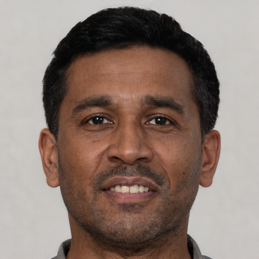 Neutral latino adult male with short  black hair and brown eyes