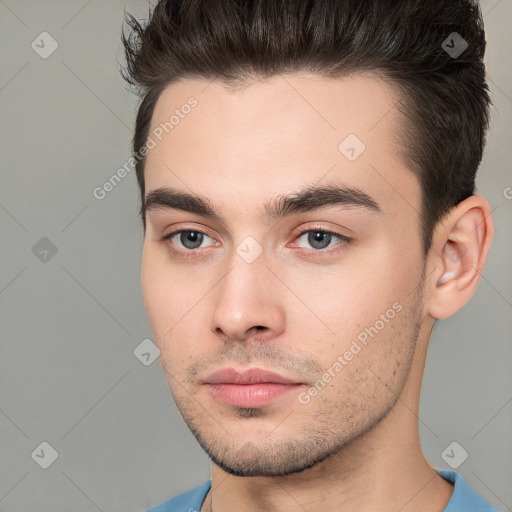 Neutral white young-adult male with short  brown hair and brown eyes