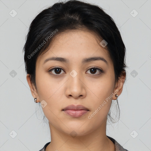 Joyful asian young-adult female with medium  black hair and brown eyes