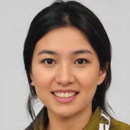 Joyful asian young-adult female with medium  brown hair and brown eyes