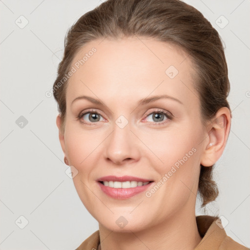 Joyful white young-adult female with medium  brown hair and grey eyes