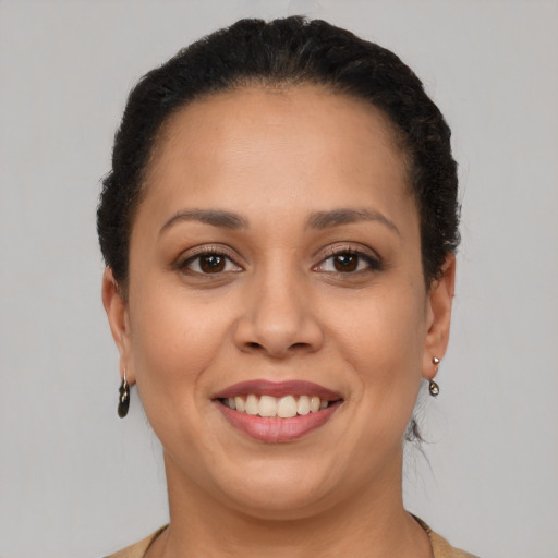 Joyful latino young-adult female with short  brown hair and brown eyes