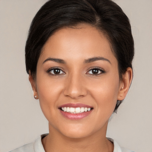 Joyful white young-adult female with medium  brown hair and brown eyes