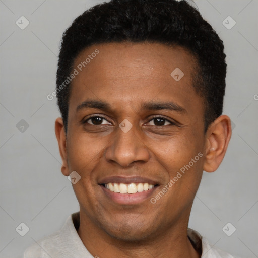 Joyful latino young-adult male with short  brown hair and brown eyes