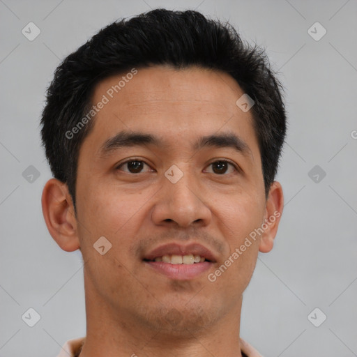 Joyful latino young-adult male with short  brown hair and brown eyes