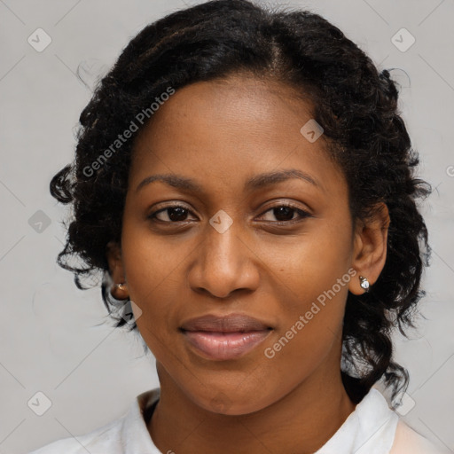 Joyful black adult female with medium  brown hair and brown eyes