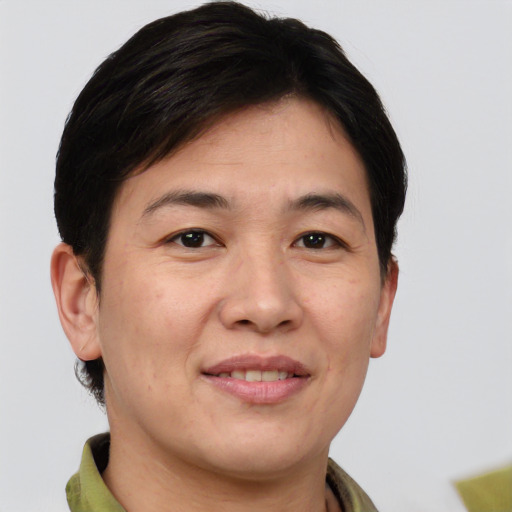 Joyful white adult female with short  brown hair and brown eyes
