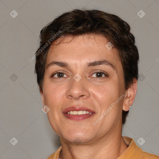 Joyful white adult female with short  brown hair and brown eyes