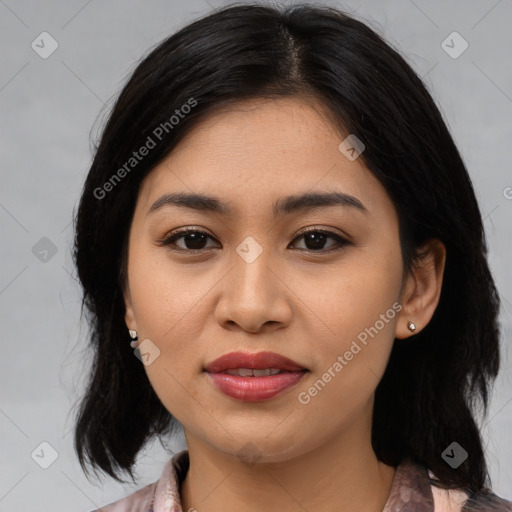 Joyful asian young-adult female with medium  black hair and brown eyes