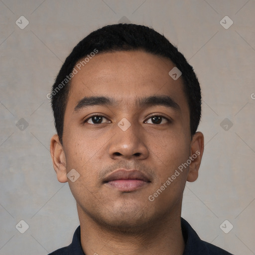 Neutral latino young-adult male with short  black hair and brown eyes