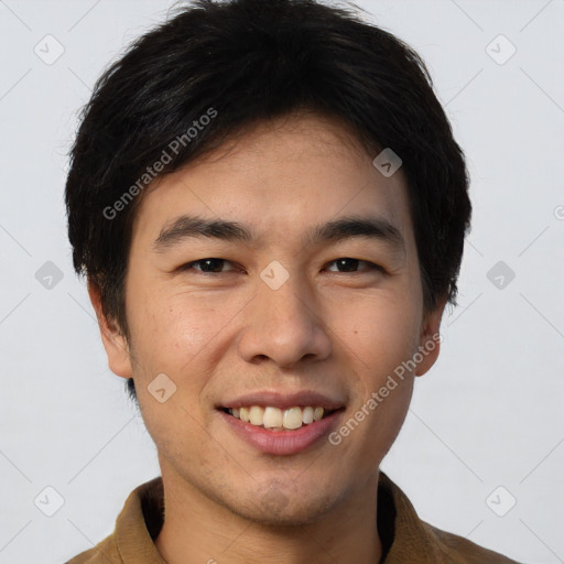 Joyful asian young-adult male with short  brown hair and brown eyes