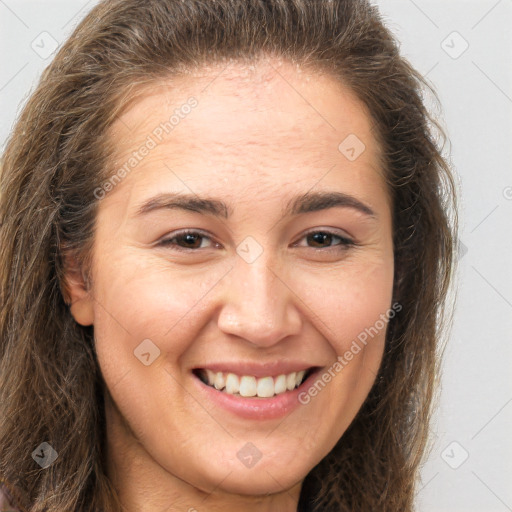 Joyful white young-adult female with long  brown hair and brown eyes