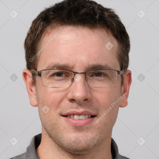 Joyful white adult male with short  brown hair and grey eyes