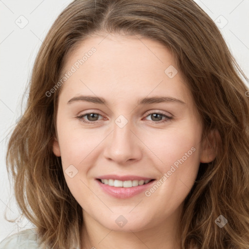 Joyful white young-adult female with long  brown hair and green eyes