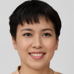 Joyful asian young-adult female with short  brown hair and brown eyes