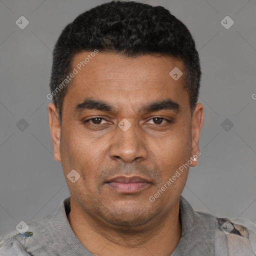 Neutral latino adult male with short  black hair and brown eyes