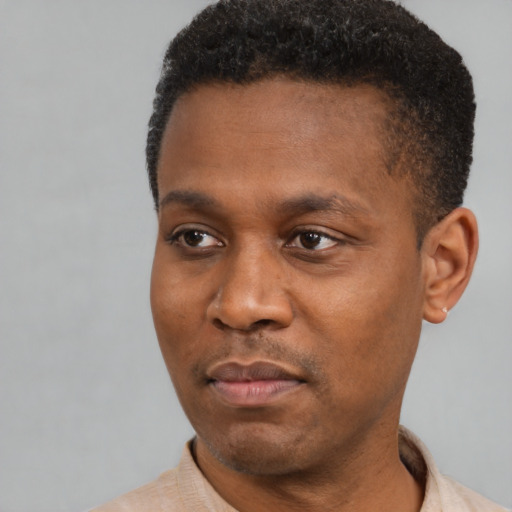 Neutral black young-adult male with short  black hair and brown eyes