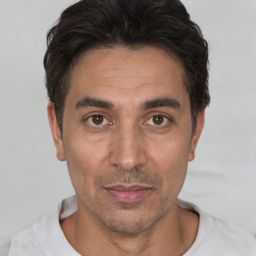 Neutral white adult male with short  black hair and brown eyes