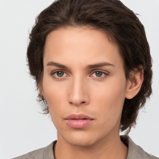 Neutral white young-adult female with short  brown hair and brown eyes