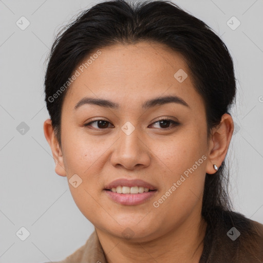 Joyful asian young-adult female with long  brown hair and brown eyes