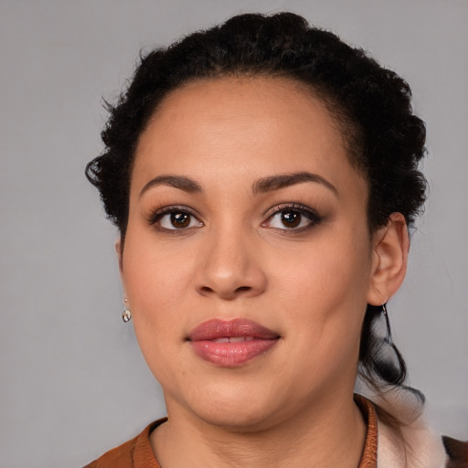 Joyful latino young-adult female with short  brown hair and brown eyes