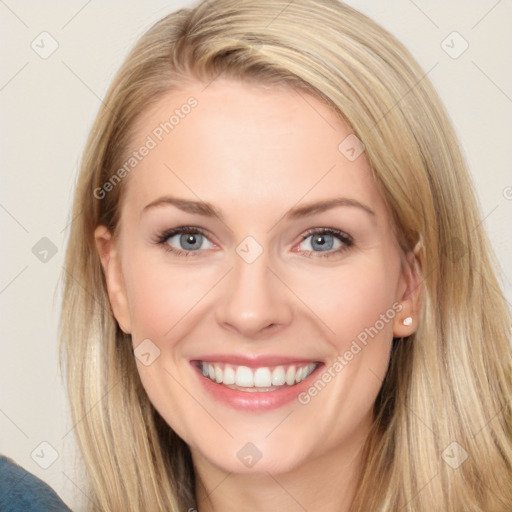 Joyful white young-adult female with long  brown hair and blue eyes